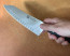 Zwilling Pro 7 in. HE Rocking Santoku person holding knife