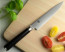 Shun Classic 6 in. (150mm) Utility Knife on cutting board with vegetables