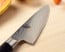Shun Classic 6 in. (150mm) Chef Knife shown on cutting board