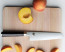 Shun Classic 6.5 in. Master Utility Knife shown with peach slices