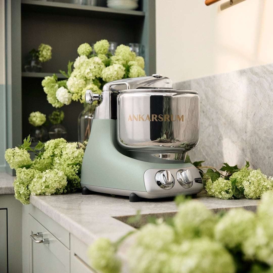 Ankarsrum Assistent Original stand mixer on a marble kitchen counter