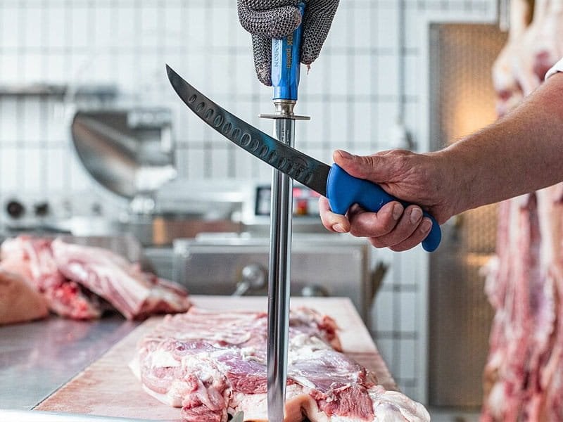 Honing steel being used to maintain a kitchen knife edge