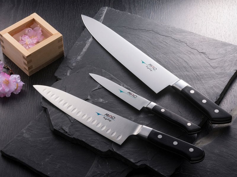 A MAC Pro Chefs Knife on a plate