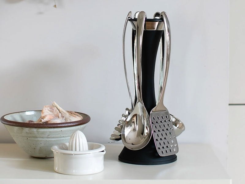 A set of stainless steel Robert Welch Signature kitchen utensils.