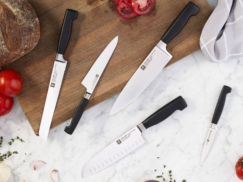 A collection of Zwilling Four Star knives.