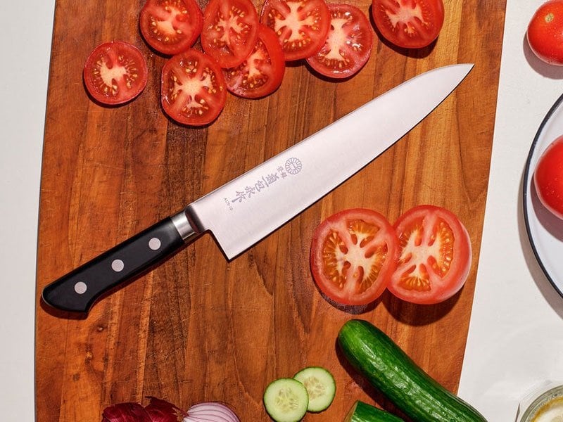 A Kikuichi Molybdenum stainless steel chef knife.